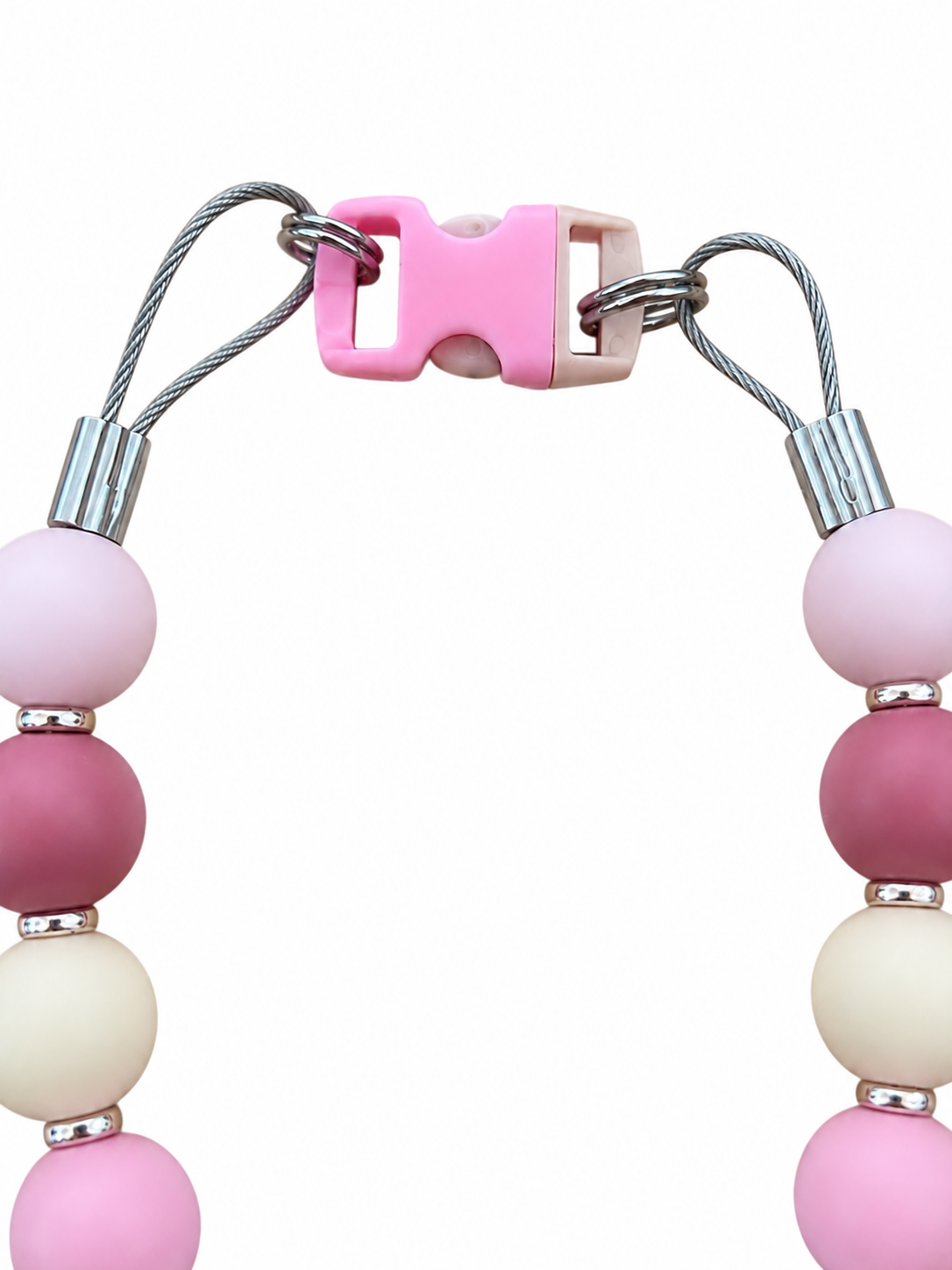 Close-up of the Neutral Pawsch beaded dog necklace showing the pink clasp, silver rings, cable, crimps, and pastel beads on a white background